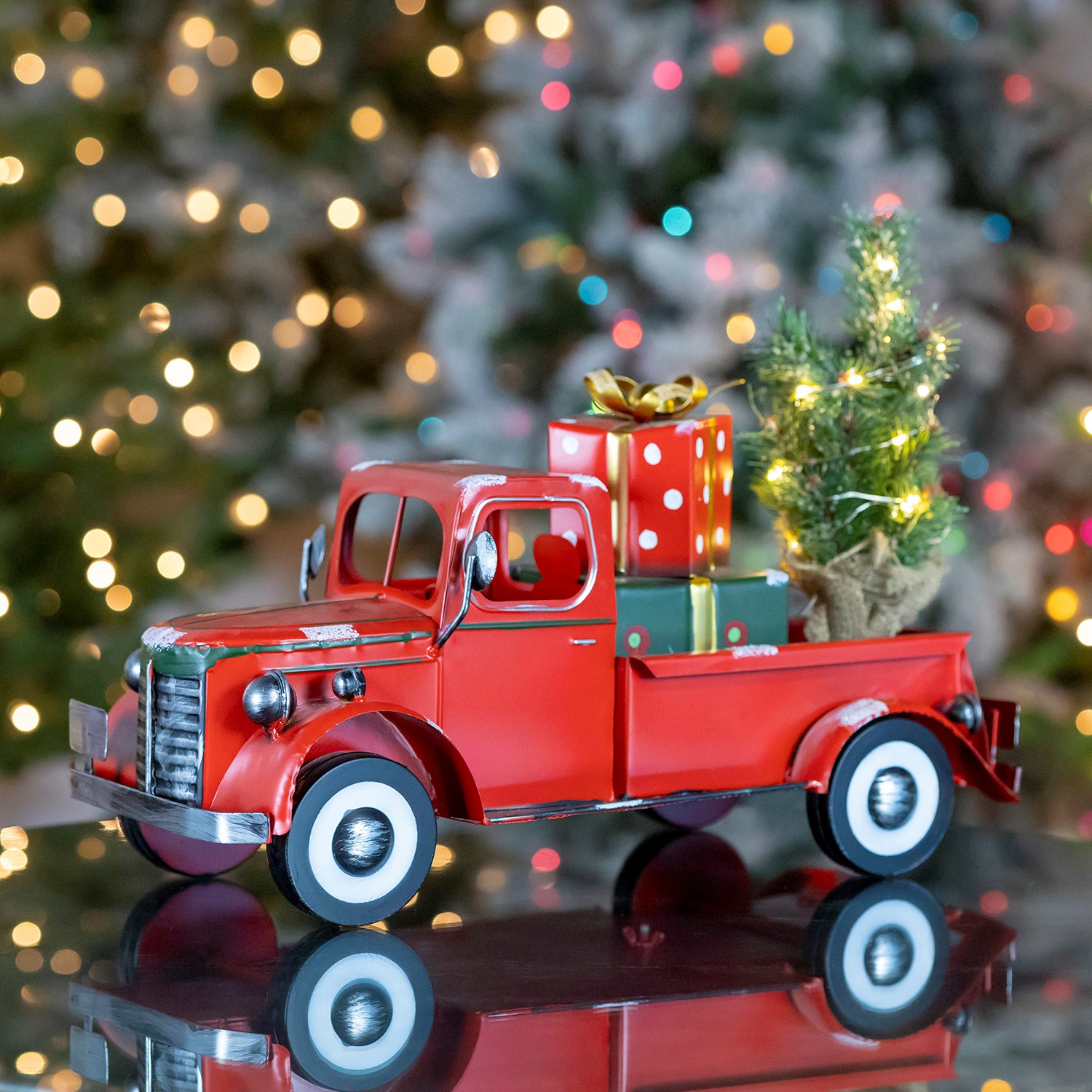Snow Covered Pickup Truck with Lighted Christmas Tree and Gifts