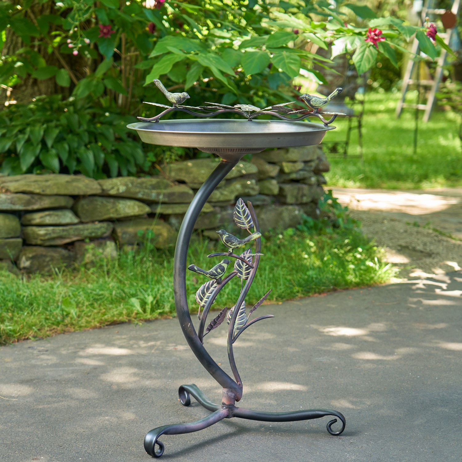 Round galvanized authentic birdbath with branch holder and bird detail