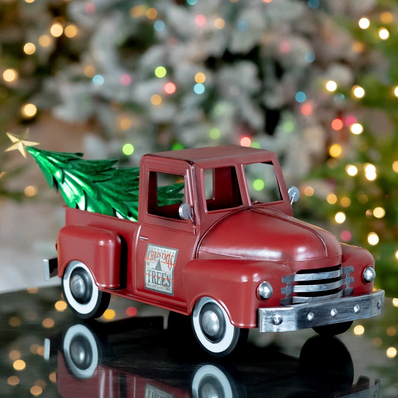 Red toy truck with cheap christmas tree