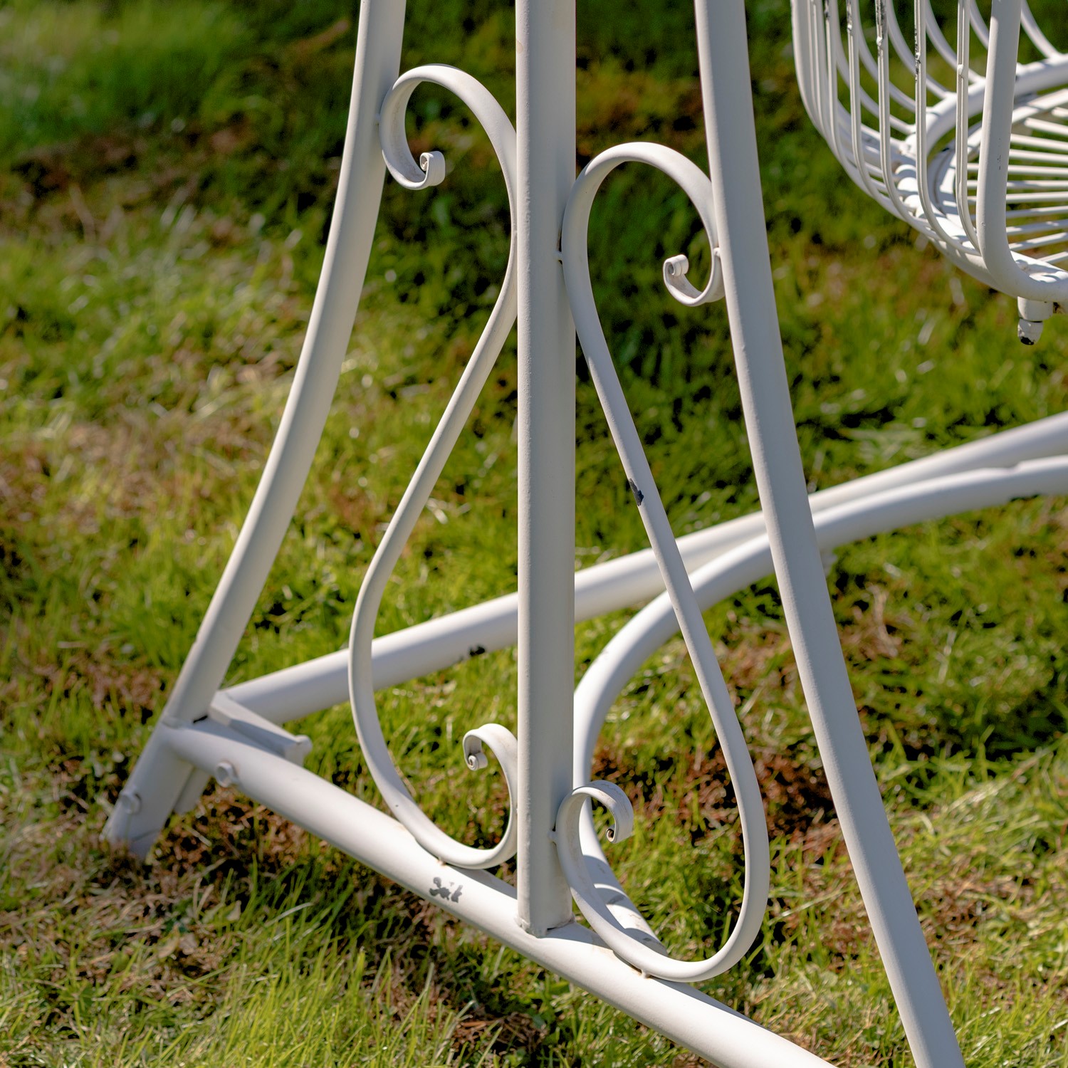 white metal garden swing